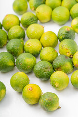 Fresh little limes on pure white background