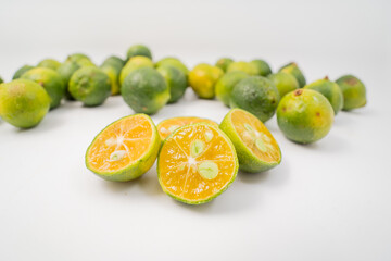 Fresh little limes on pure white background