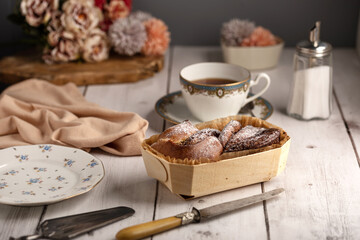 Fresh brioche in a wooden wrapping