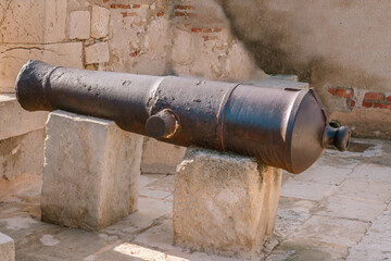 Old steel cannon in Santa Barbara Castle in Alicante. ALICANTE, SPAIN - NOVEMBER 19, 2021