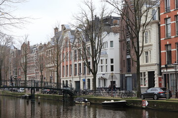Amsterdam Oudezijds Voorburgwal Canal View with Buildings and Bridge, Netherlands