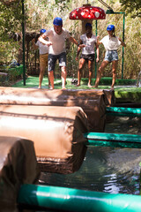 Fototapeta na wymiar Two teams compete on an obstacle course in an amusement park. High quality photo