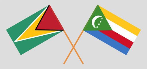 Crossed flags of Guyana and the Comoros. Official colors. Correct proportion
