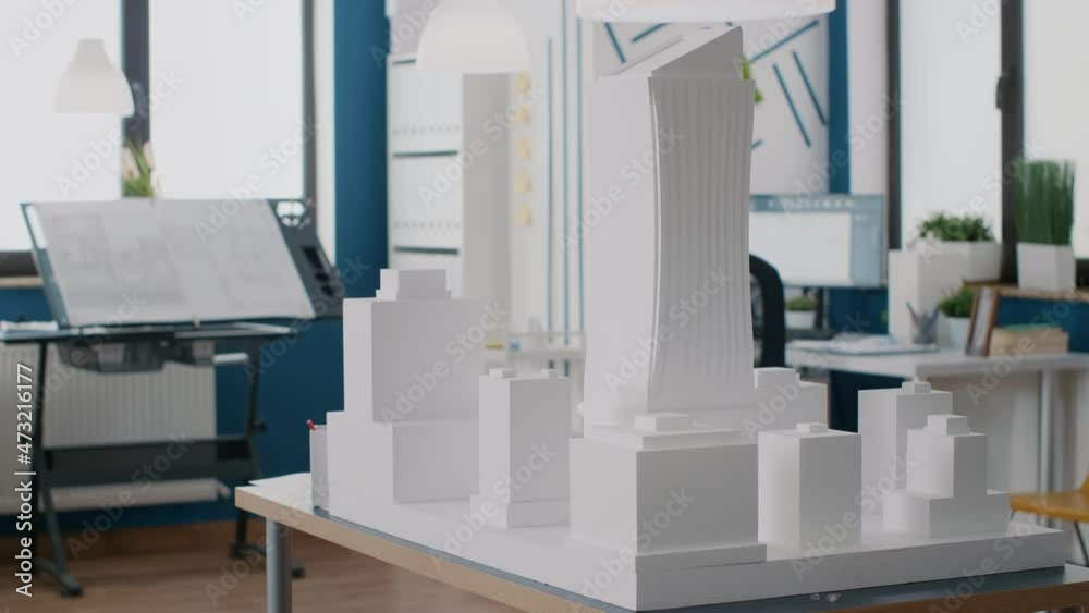 Poster empty architectural office with building model and maquette on table. nobody in space with blueprint