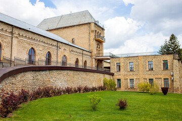 Old building of last century with greens and flowers outside. Shato trubetskogo is an old place where to explore the most popular natural wines..