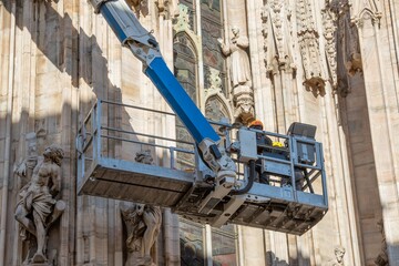 Technicians on lifting platform for scheduled maintenance plan and study of the degradation...