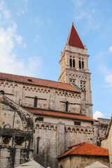 Fototapeta na wymiar Bell tower of famous Saint Lawrence cathedral in Trogir
