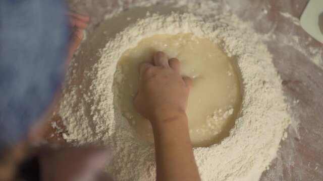 zenithal shot of woman making cake