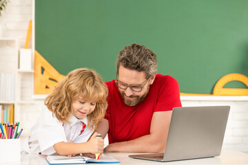 father and child study in classroom with laptop, knowledge