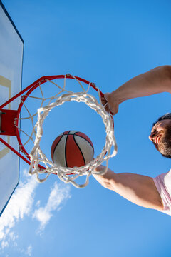 Slam Dunk In Motion. Top View. Summer Activity. Man With Basketball Ball On Court.