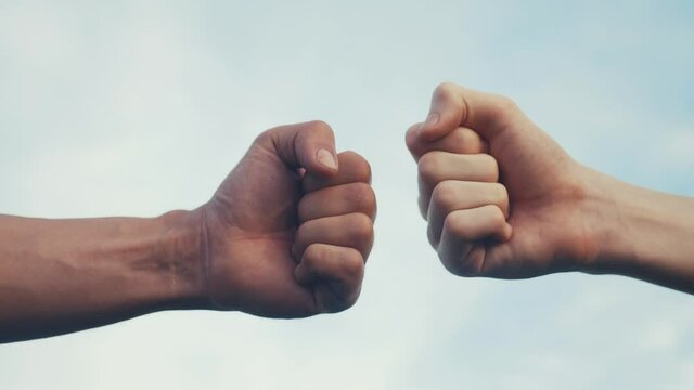 teamwork concept. fist to fist commit solidarity a respect and brotherhood gesture. business team hands fists close-up. people of lifestyle different skin colors partnership friendship teamwork
