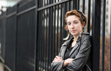 Portrait of a twenty year old girl with an urban background