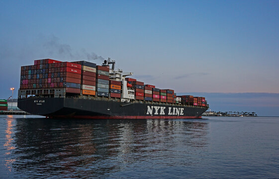 Los Angeles, California USA - March 4, 2019: Loaded container ship NYK Atlas in main channel of Port of Los Angeles heading outbound toward open ocean, part of the worldwide supply chain.