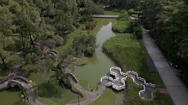 Aerial View Of Toa Payoh Town Park Landscaped Pond With Bridges In Singapore. - ascend
