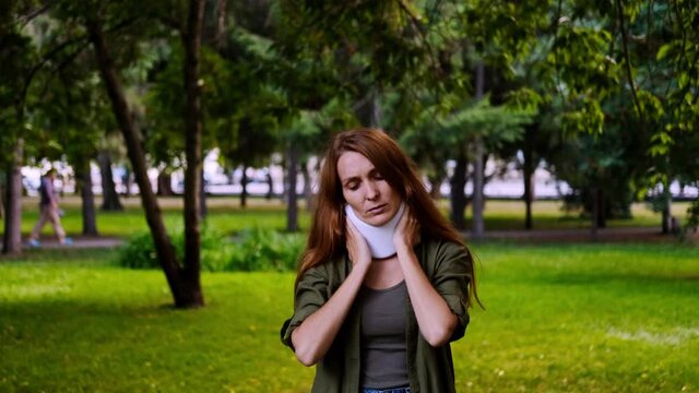 Rotary subluxation atlanta, a woman wears a cervical collar from injury, neck stretching, muscle pain, concussion, sprain of the ligaments, displacement of the vertebrae. 
