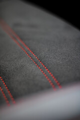 Car interior red seat stitching with suede 