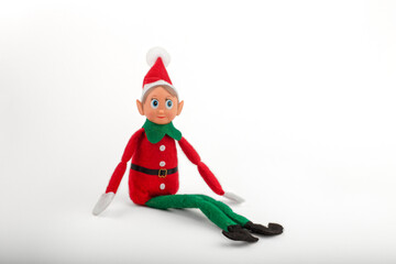 Christmas Elf toy on a white background with copy space. Christmas spirit, Christmas family tradition.