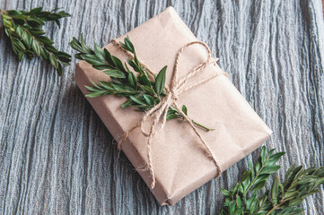 Handmade gift boxes decorated with craft paper on gauze gray.