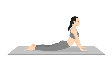 Cobra Pose, Beautiful girl practice Bhujangasana. Young attractive woman practicing yoga exercise. working out, black wearing sportswear, grey pants and top, indoor full length, calmness and relax.