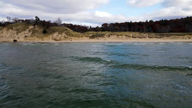 Push toward the shoreline with drone at Kruse Park in Muskegon, MI.