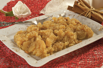 Turkish Dessert irmik helvasi / semolina with cinnamon powder and peanut
