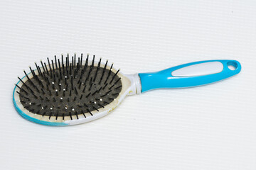 a women's comb full of filth