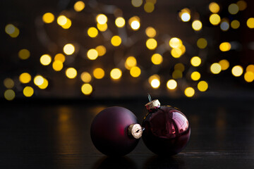 christmas balls on a background of yellow lights bokeh