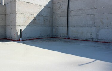 A completed concrete foundation on a building