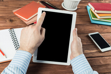 businessman with a tablet, works in the office