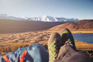 Fototapeta premium Feet Hiker relaxing enjoying view entrance outdoor. Travel Lifestyle concept adventure vacations outdoor.