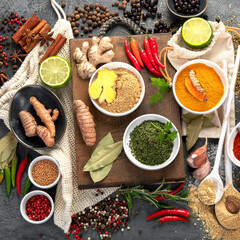Assortment of spices on gray background.