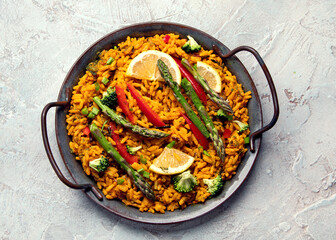 Vegan Paella on gray background.
