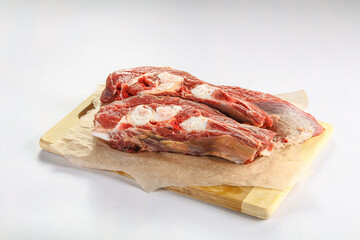 Raw bones for cooking over board