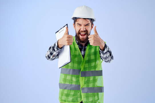 male worker in a green vestconstruction work design isolated background
