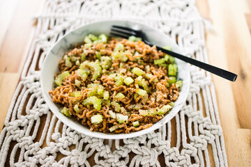 vegan instant noodles with ginger and soy sauce topped with celeri corainder seeds and chilli flakes, healthy plant-based food