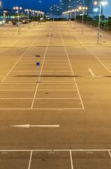 empty car park with urban background at night