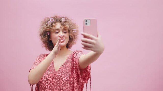 Teenage Girl Posing to Selfie Smartphone Camera, Showing V Fingers Sign, Blowing Kisses and Smiling, Studio Shot Full Frame