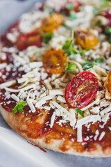 vegan margerita pizza with roasted cherry toatoes and dairy-free cheese, healthy plant-based food
