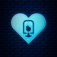 Glowing neon Heart with female icon isolated on brick wall background. Venus symbol. The symbol for a female organism or woman. Vector