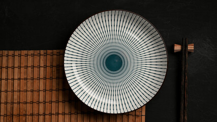 Empty blue and white ceramic plate on dining table.