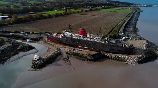 Aerial View Of Abandoned TSS Duke Of Lancaster Ship Near Mostyn Docks, North Wales - drone shot