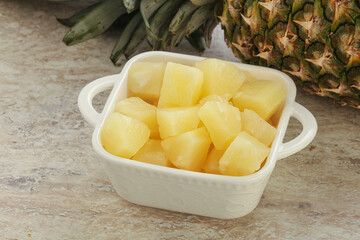 Marinated pineapple slices in the bowl