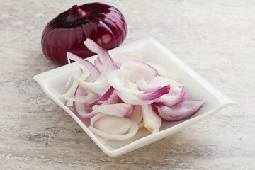 Sliced red onion in the bowl