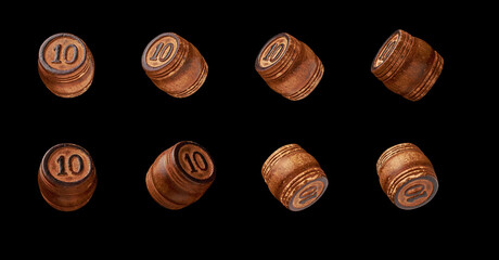 wooden barrels with the number ten are isolated in different angles on a black background