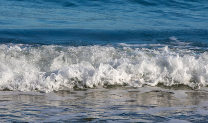 a small wave at the seashore