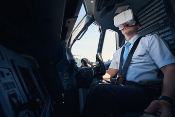 Man in augmented reality headset practising steering plane