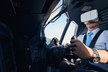 Pilot in augmented reality goggles flying a plane