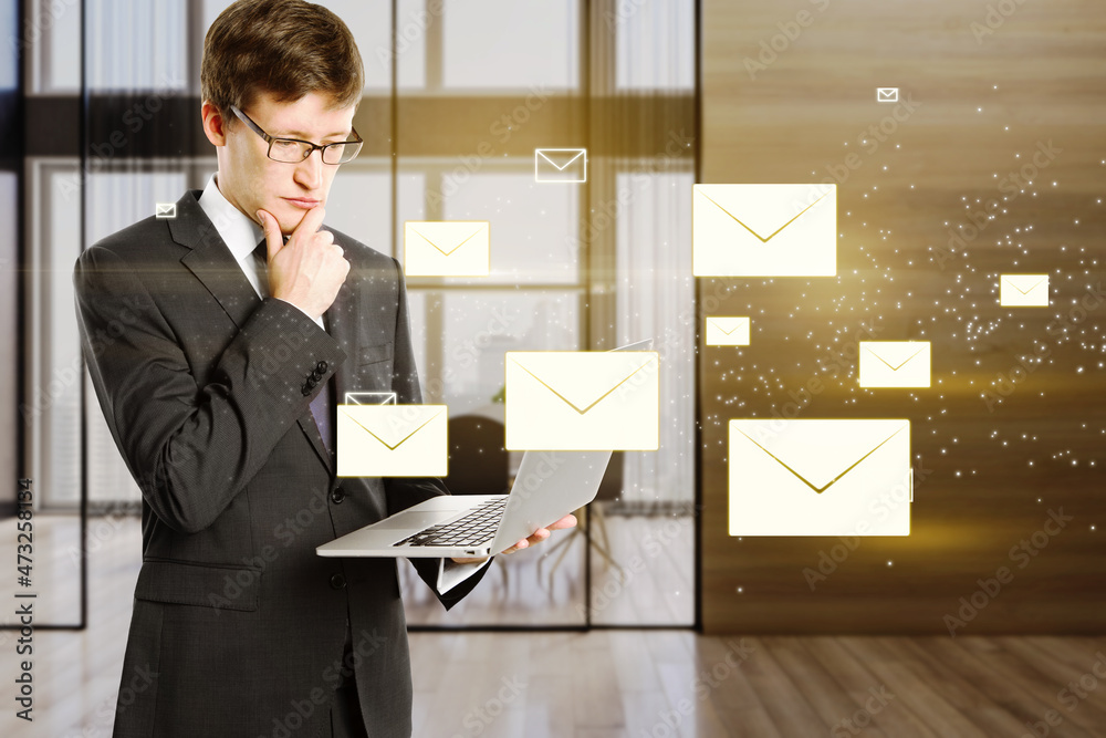 Poster attractive young european businessman using laptop with c creative glowing letters interface on blur