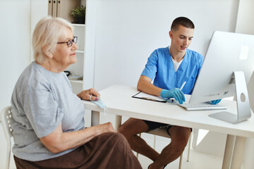 an elderly woman at a doctor's appointment diagnostics