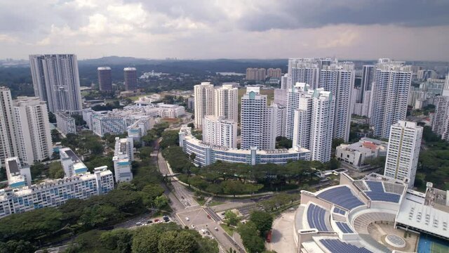 Aerial View Of Traffic And High-rise Apartment Buildings In Toa Payoh, Singapore. - tilt-down